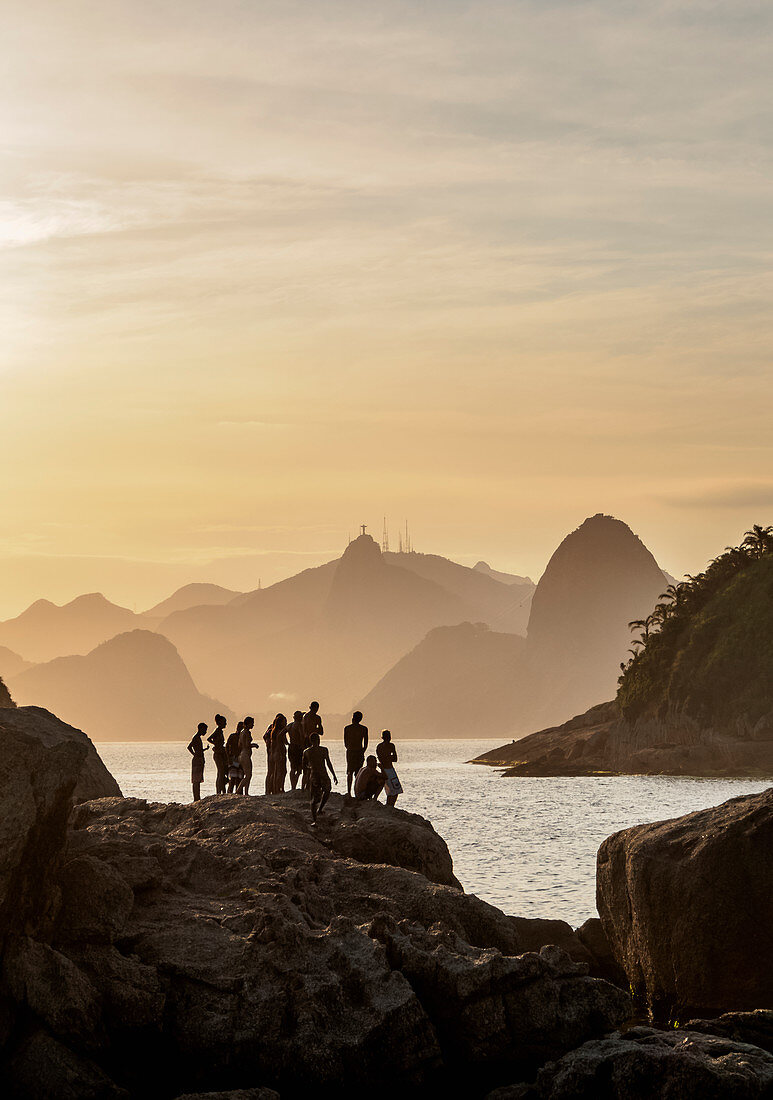 View over rocks of Piratininga towards Rio de Janeiro, sunset, Niteroi, State of Rio de Janeiro, Brazil, South America