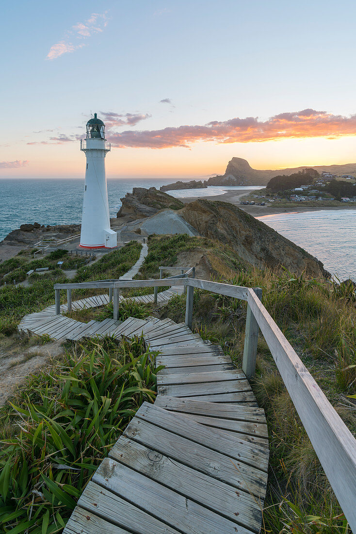 Castlepoint lighthouse and Castle Rock at sunset, Castlepoint, Wairarapa region, North Island, New Zealand, Pacific