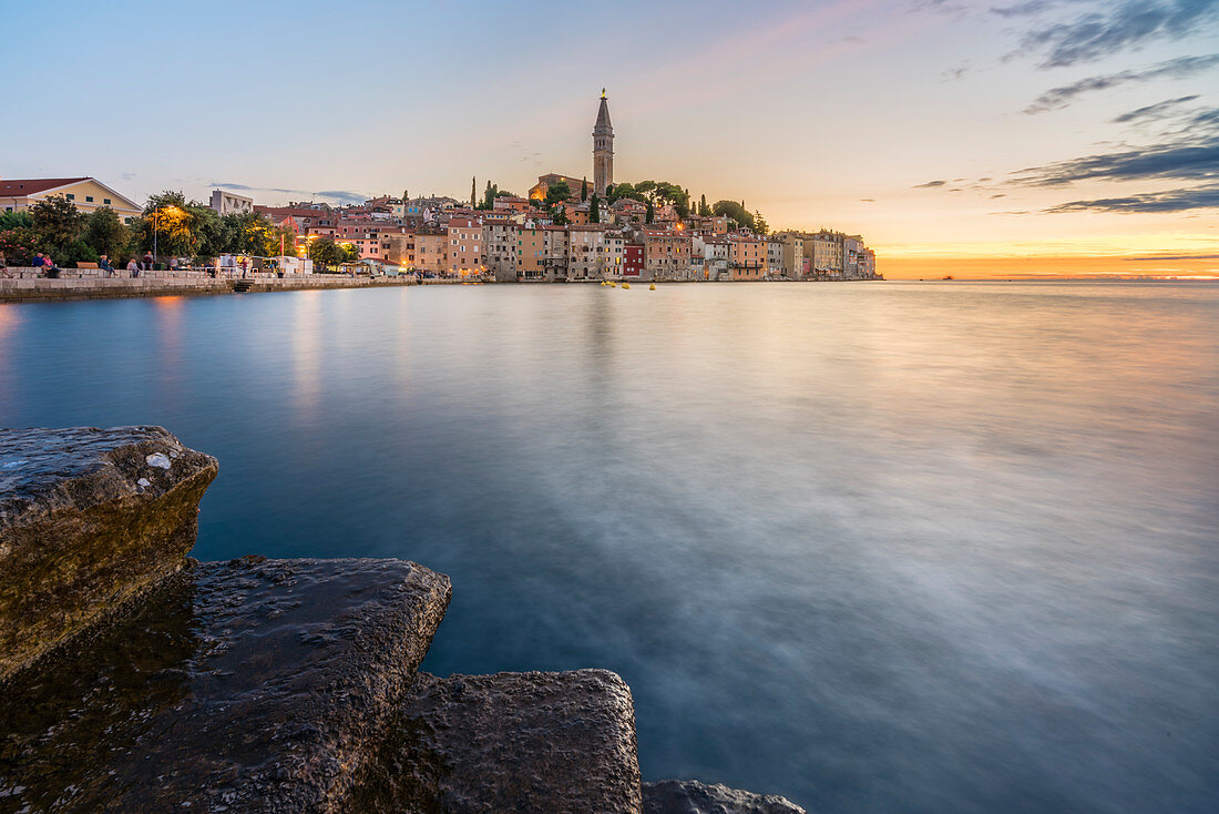 The old town at sunset, in summer, with stone steps in the foreground, Rovinj, Istria county, Croatia, Europe