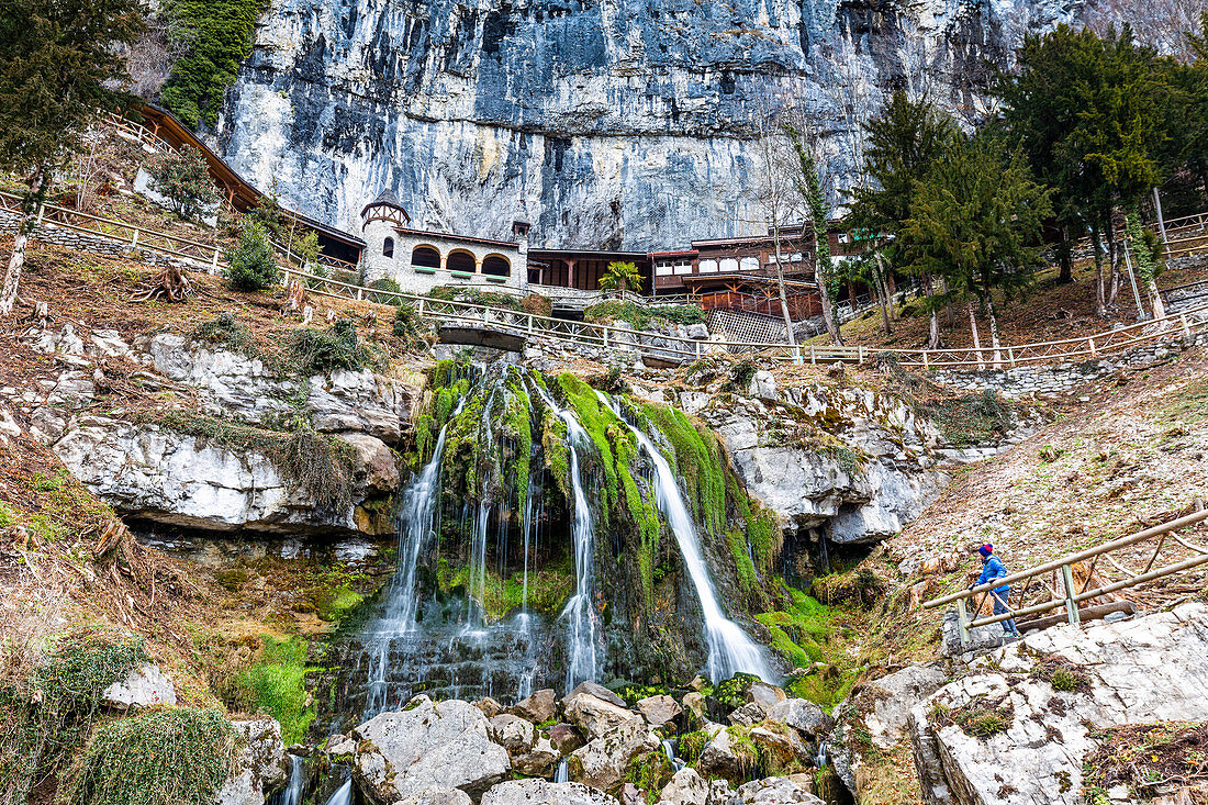 Tourist looking at St. Beatus Waterfall, Beatenberg, Canton of Bern, Switzerland, Europe
