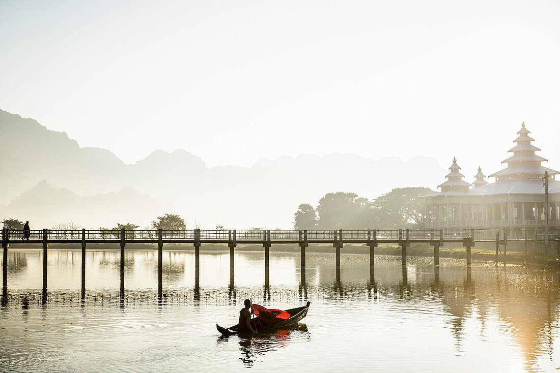 Mountains and bridge reflected in still lake, Hpa an, Kayin, Myanmar