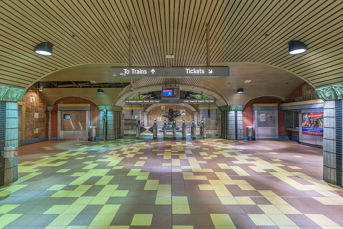 Turnstiles and signs in subway station, USA