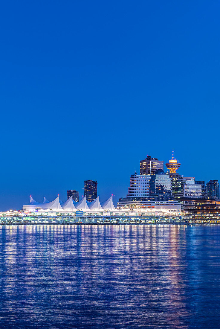 Waterfront skyline illuminated at night, Vancouver, British Columbia, Canada,