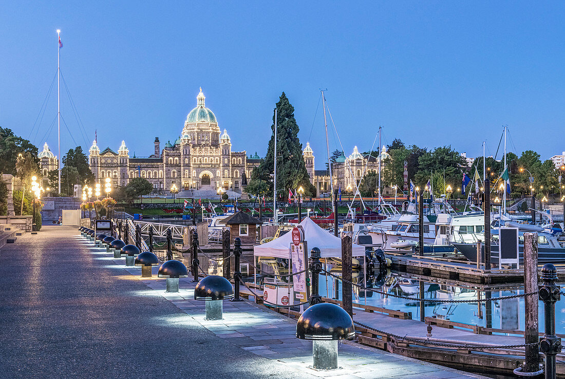 Parliament Buildings and harbor illuminated at dawn, Victoria, British Columbia, Canada