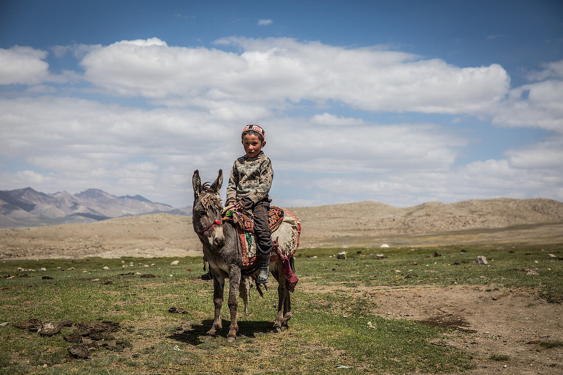 Kirgise on donkey in the Pamir, Afghanistan, Asia