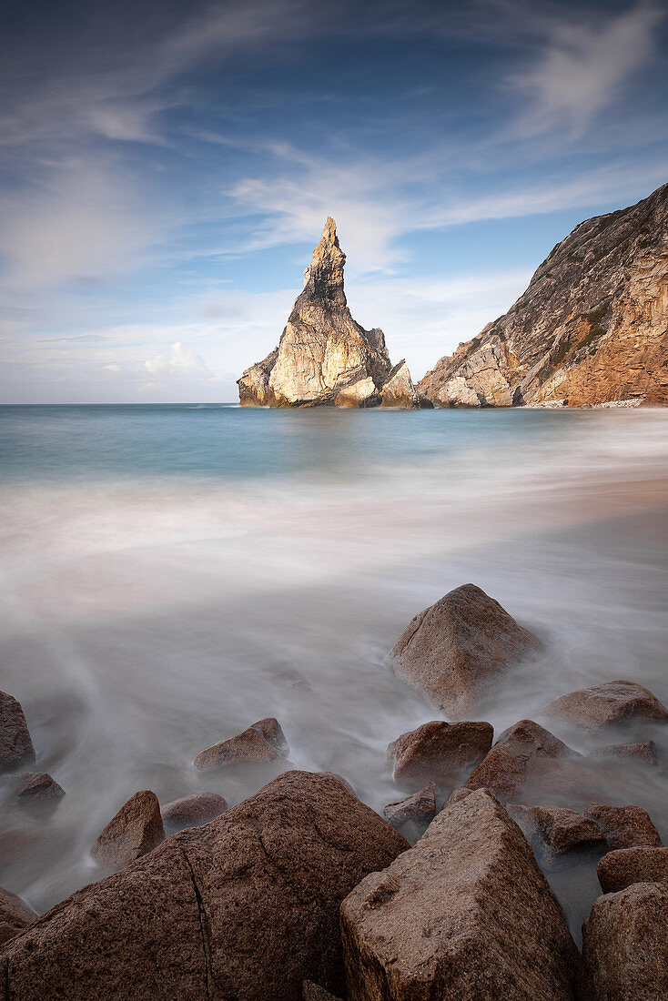 View of the rocks of Praia da Ursa, in the foreground small rocks, Colares, Sintra, Portugal