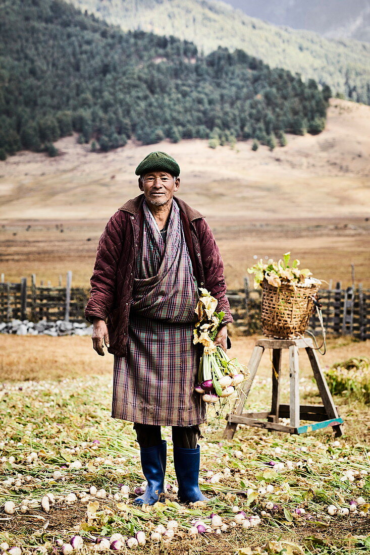 A turnip farmer wearing a traditional gho, Bhutan