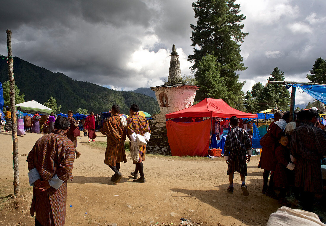 People at a fair on dirt road, feast at Gangteng Monastery, Phobjikha Valley, Bhutan, Himalayas, Asia