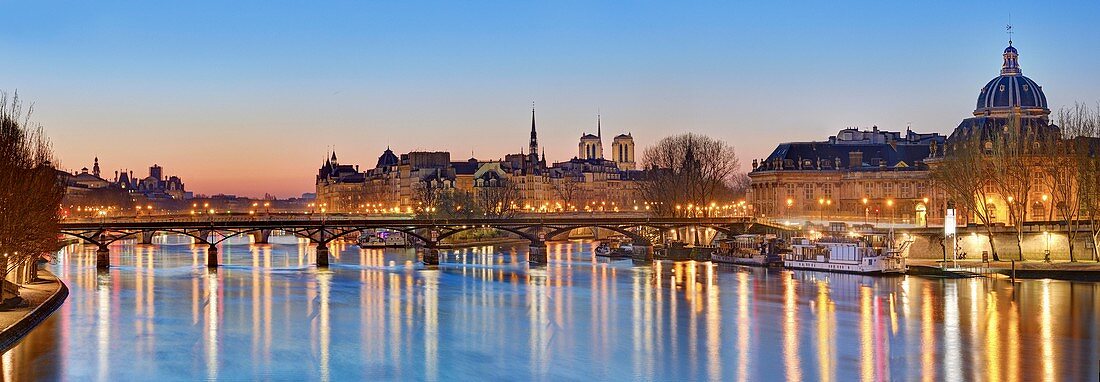 France, Paris, area listed as World Heritage by UNESCO, with the Arts bridge, the cupola of the Institute of France and the City island