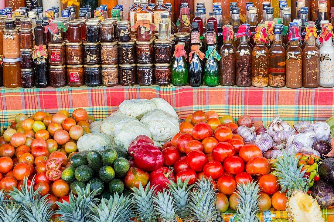 France, Guadeloupe (French West Indies), Grande Terre, Saint Francois, market stall with various local products aranges rum punches, jams, honey, fruits and vegetables