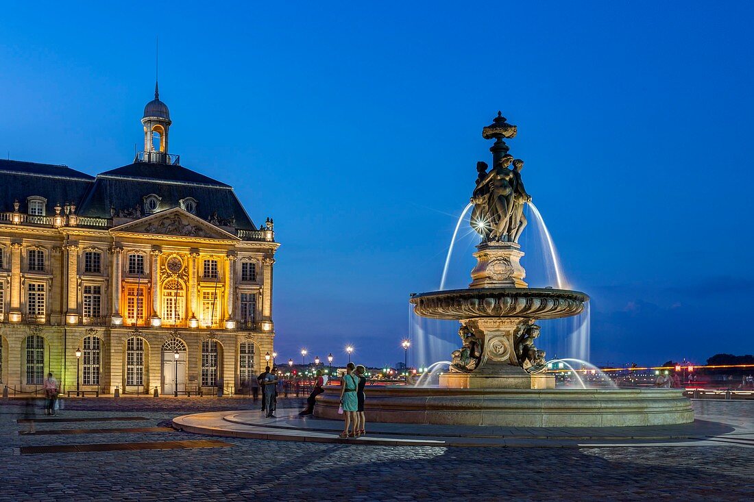 France, Gironde, Bordeaux, area listed as World Heritage by UNESCO, Square of Bourse fountain and the three graces