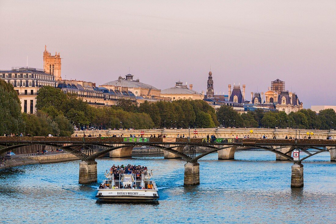 France, Paris, area listed as World Heritage by UNESCO, the gateway of Arts and a riverboat