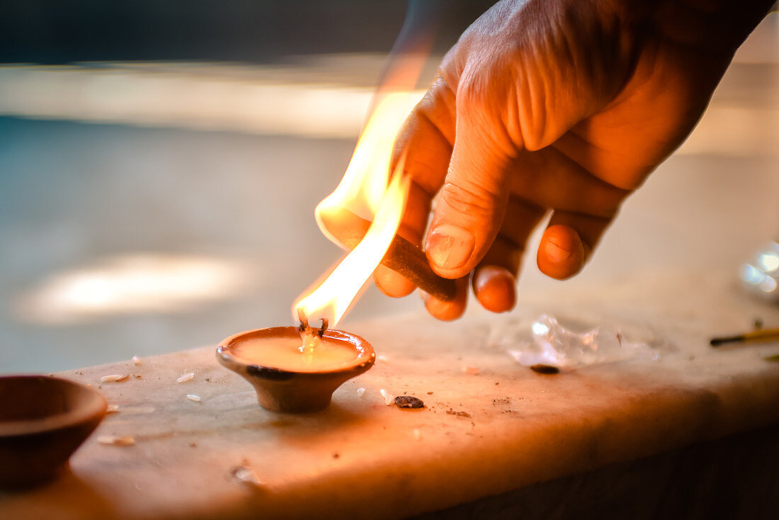 2019, Ter Kadamba, Govardhan, Vrindavan, Uttar Pradesh, India, Shiva Temple Asheshvara Mahadeva, incense sticks are lit on candle to worship Shiva