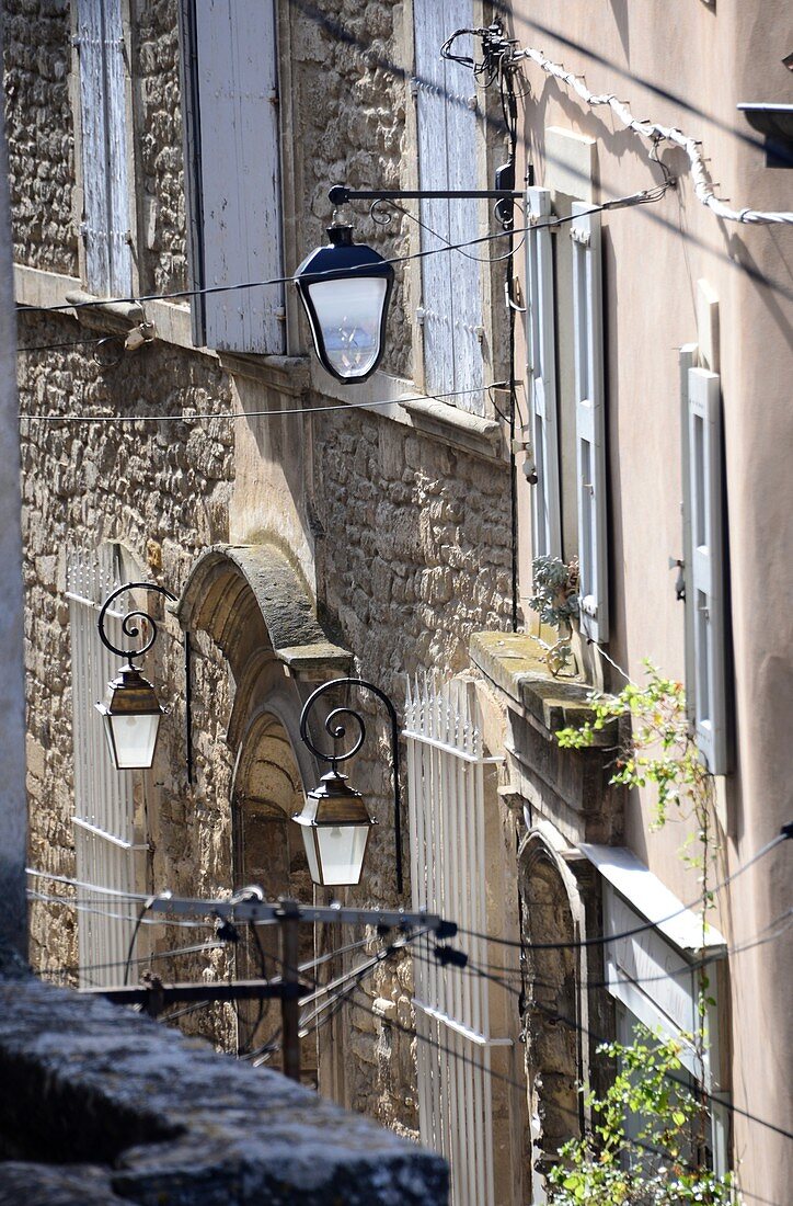 Medieval houses and lanterns in the upper town, Bonnieux in the Luberon, Provence, France