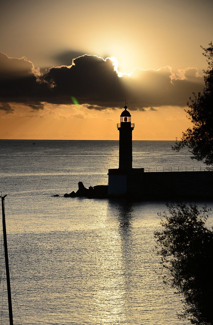 Sunrise view of the sea with harbor with lighthouse, Bastia, North Corsica, France