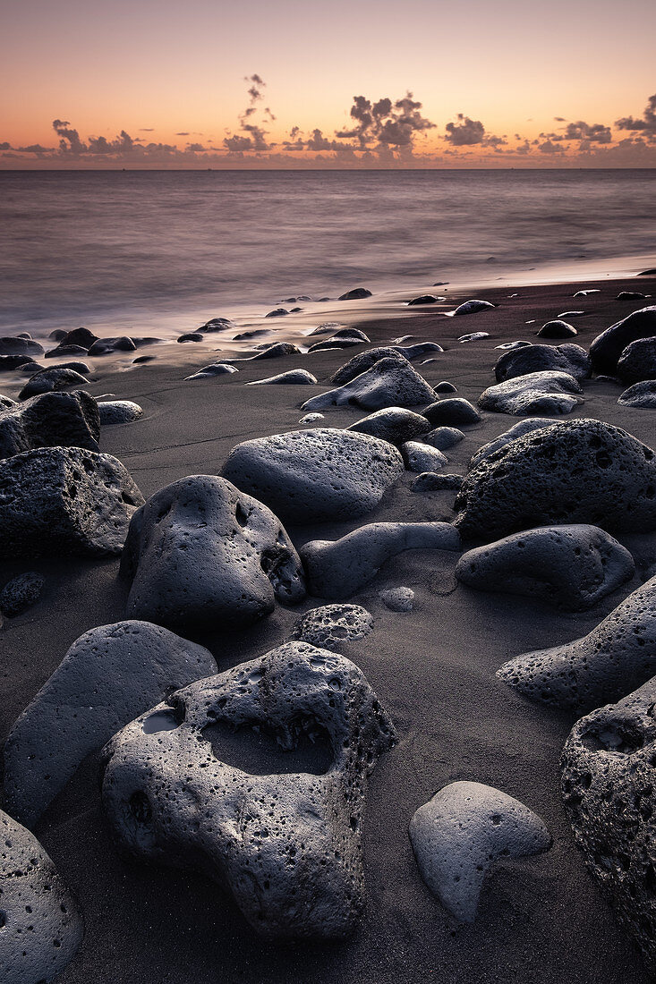 View of the sunset on the black beach in the fishing village of la Bombilla, La Palma, Canary Islands, Spain, Europe