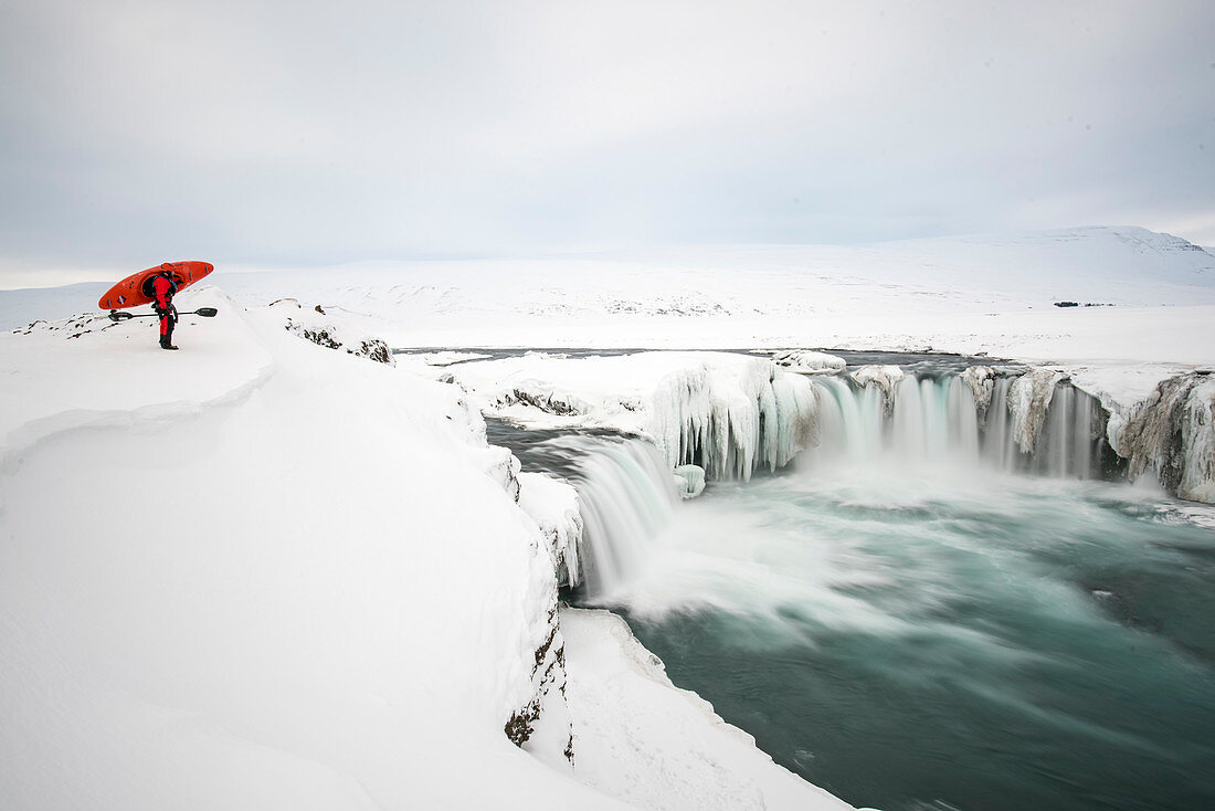 Winter kayaking on Godafoss in northern Iceland