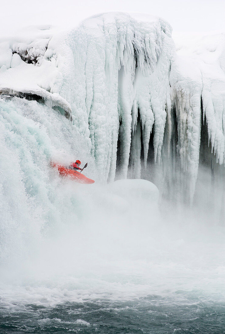 Winter kayaking on Godafoss in northern Iceland