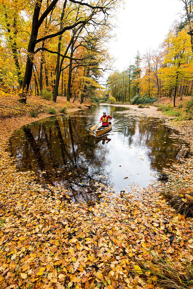 Canoeing in autumn on the Rakotzsee, Saxony, Germany