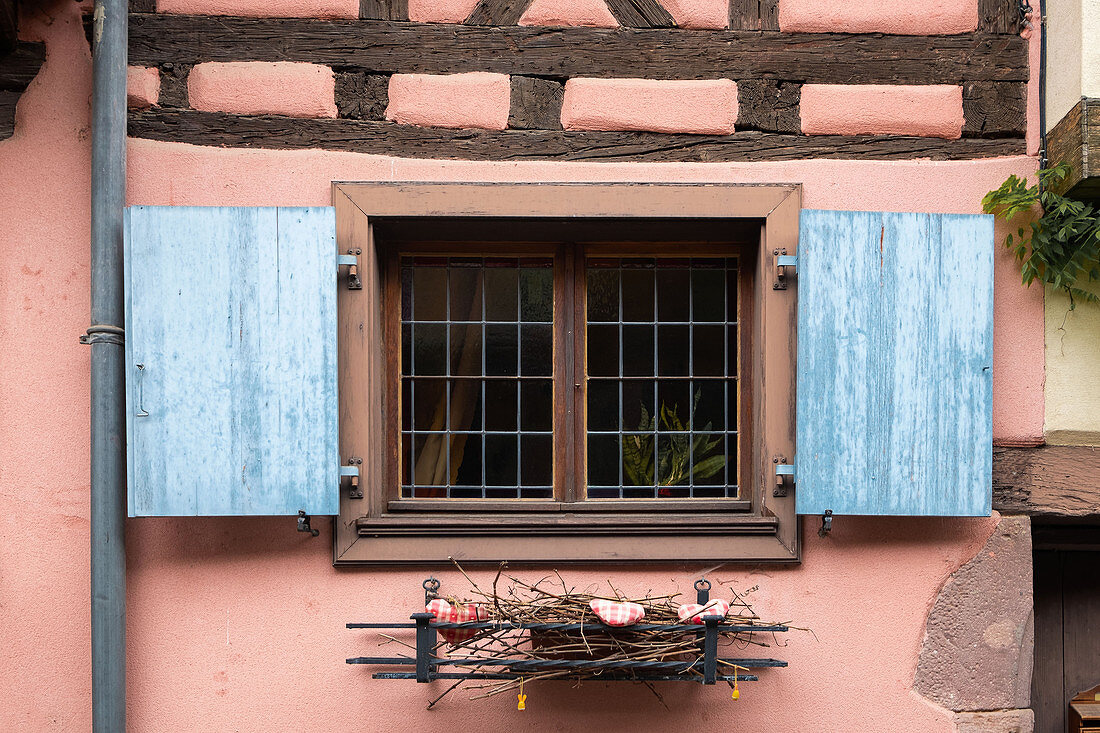 Shutters in half-timbered house in Eguisheim in Alsace, France, Europe