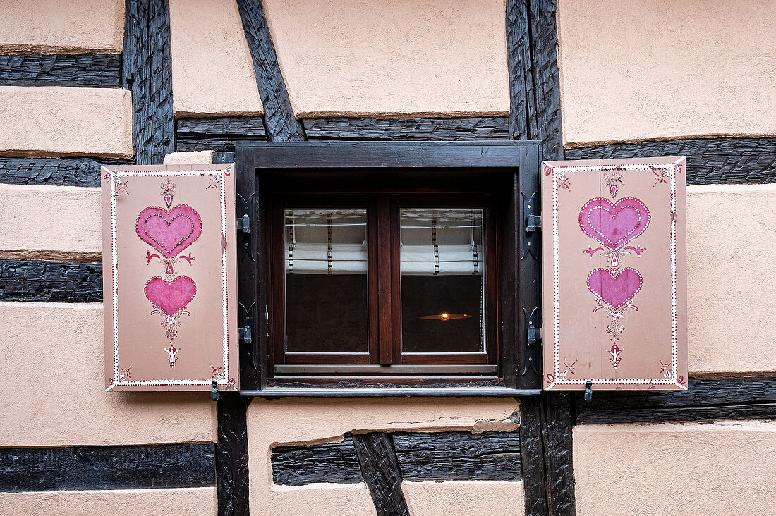 Shutters in half-timbered house in Eguisheim in Alsace, France, Europe