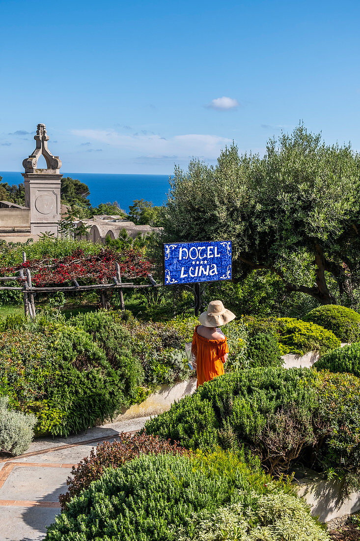Woman at the entrance to Hotel Luna on Capri, Capri Island, Gulf of Naples, Italy