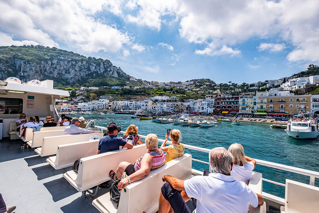 People on the ferry entering Capri, Capri Island, Gulf of Naples, Italy