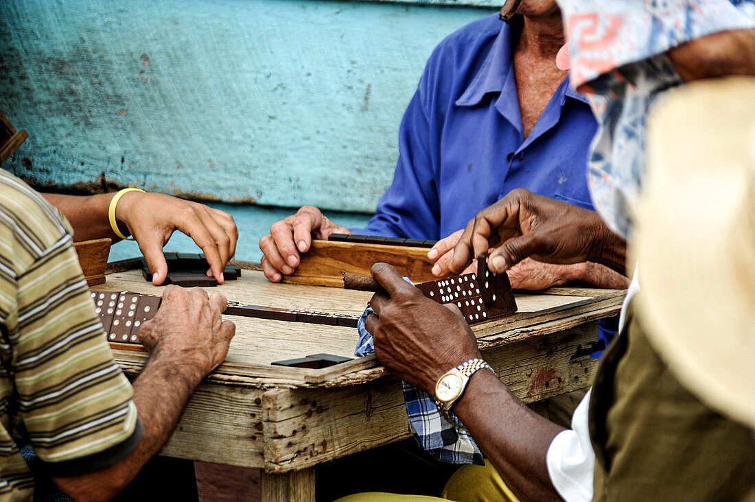 Men play dominoes on the street in the capital of Cuba. Havana.