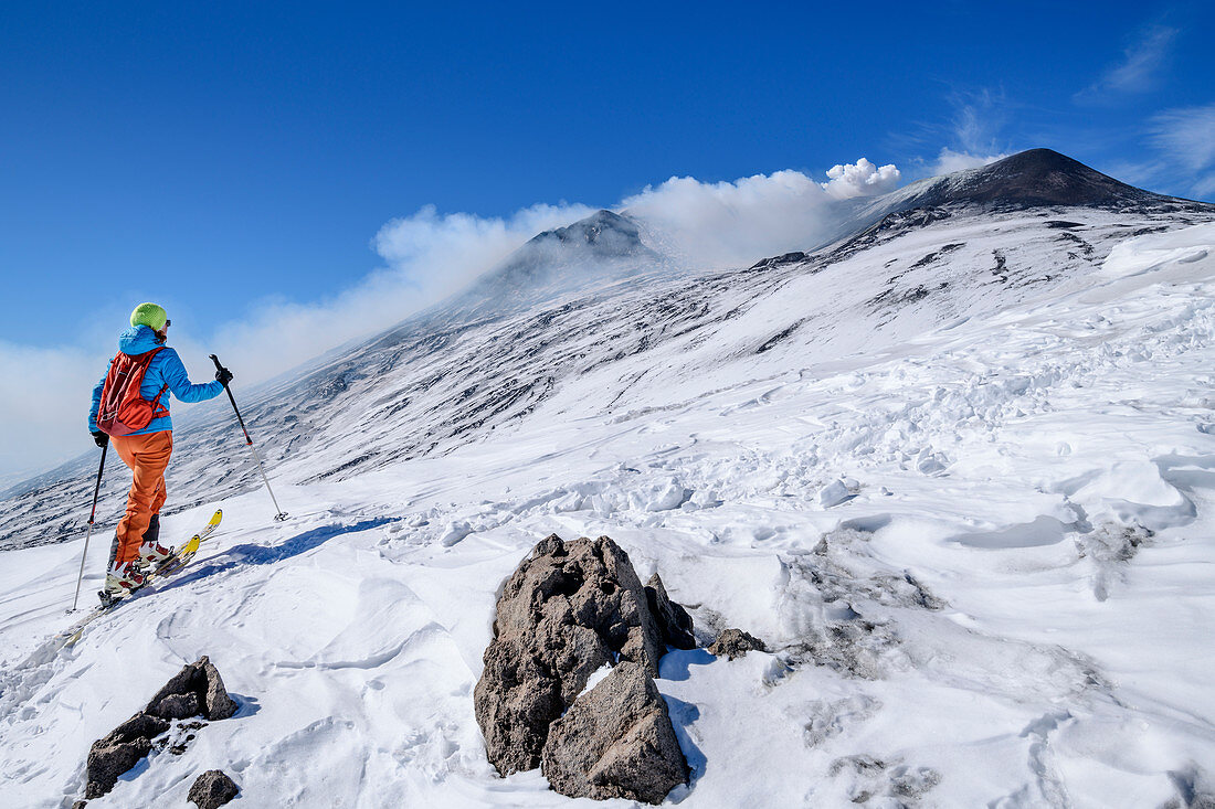 Woman on ski tour climbs to Mount Etna, UNESCO World Heritage Site, Monte Etna, Etna, Etna, Sicily, Italy