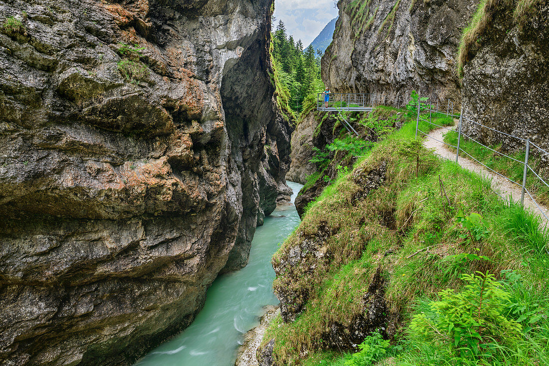 Woman while hiking looks at Kaiserklamm, Kaiserklamm, Brandenberger Ache, Bavarian Alps, Tyrol, Austria