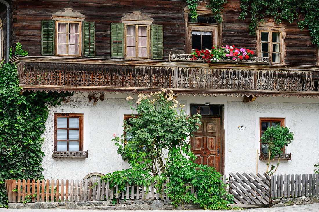 Traditional farmhouse with floral decoration, Stumm, Zillertal, Tyrol, Austria