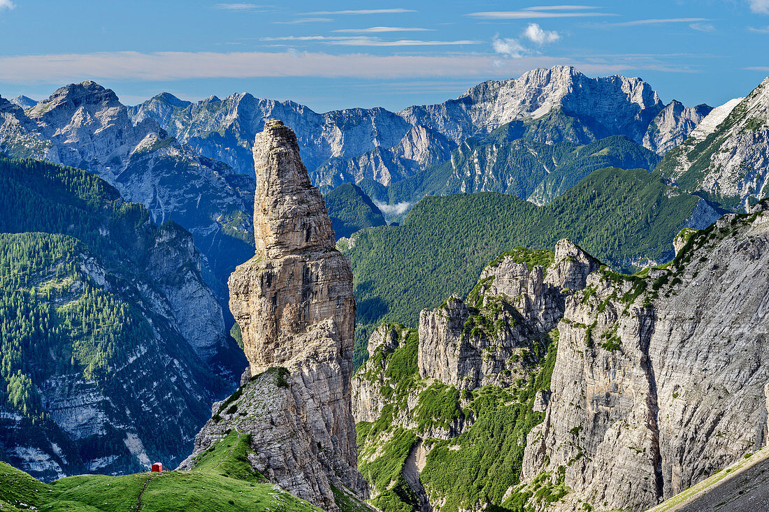 Rock tower with small red bivouac box stands against mountain backdrop, Val Cimoliana, Dolomites, UNESCO World Heritage Dolomites, Veneto, Italy