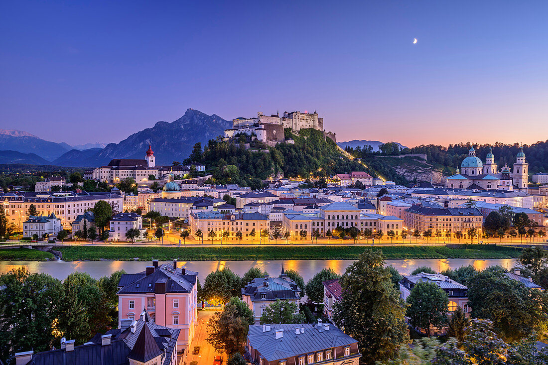 Illuminated old town of Salzburg with Nonnberg Abbey, Hohensalzburg and Dom over Salzach with Hoher Göll in the background, Salzburg, Austria