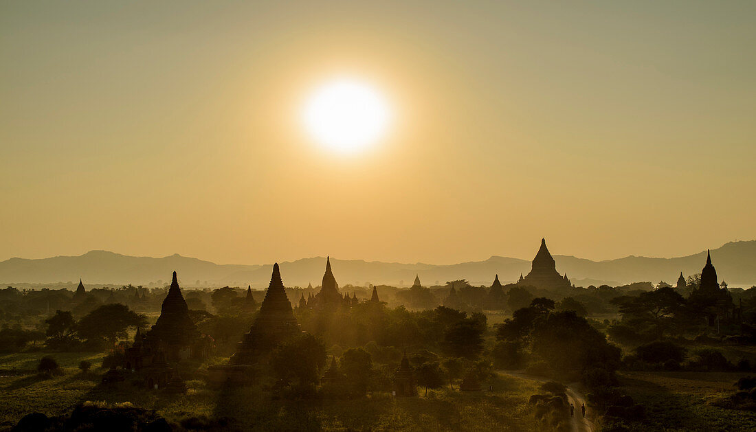 Sunset over stupas of temples in Bagan, Myanmar.