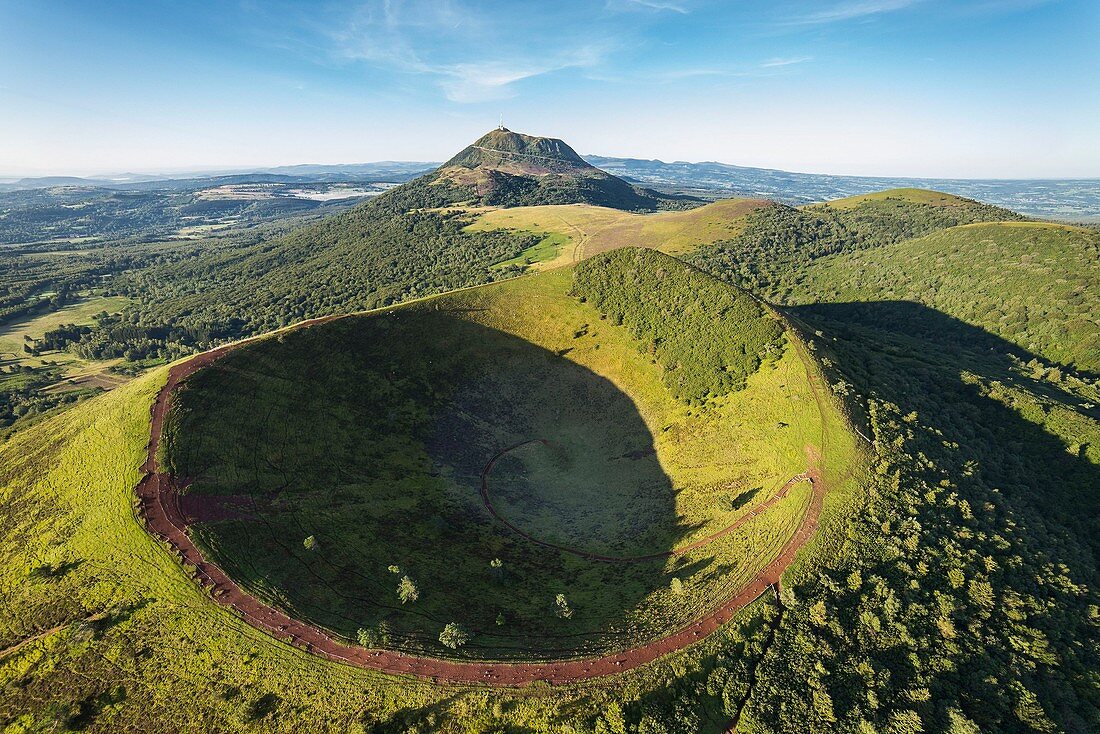 France, Puy de Dome, area listed as World Heritage by UNESCO, the Regional Natural Park of the Volcanoes of Auvergne, Chaine des Puys, Orcines, the crater of Puy Pariou volcano, the Puy de Dome volcano in the background (aerial view)