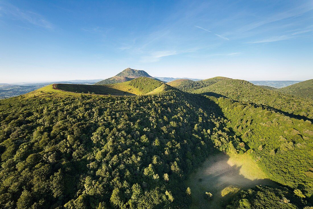 France, Puy de Dome, area listed as World Heritage by UNESCO, the Regional Natural Park of the Volcanoes of Auvergne, Chaine des Puys, Orcines, the Puy Pariou volcano, the Puy de Dome volcano in the background (aerial view)