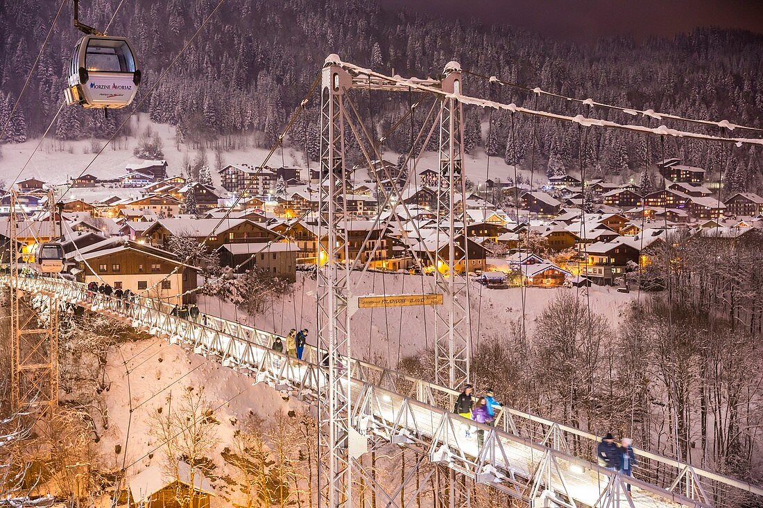France, Haute-Savoie, Morzine, the valley of Aulps, ski slopes of the Portes du Soleil, cable car of Super Morzine and footbridge François-Baud, suspension bridge and footbridge for pedestrians finished in 1952