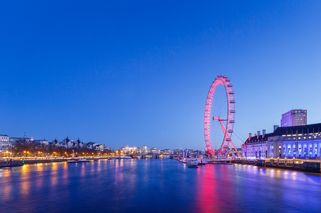 London Eye illuminated at night with view of the River Thames, London, England, United Kingdom, Europe