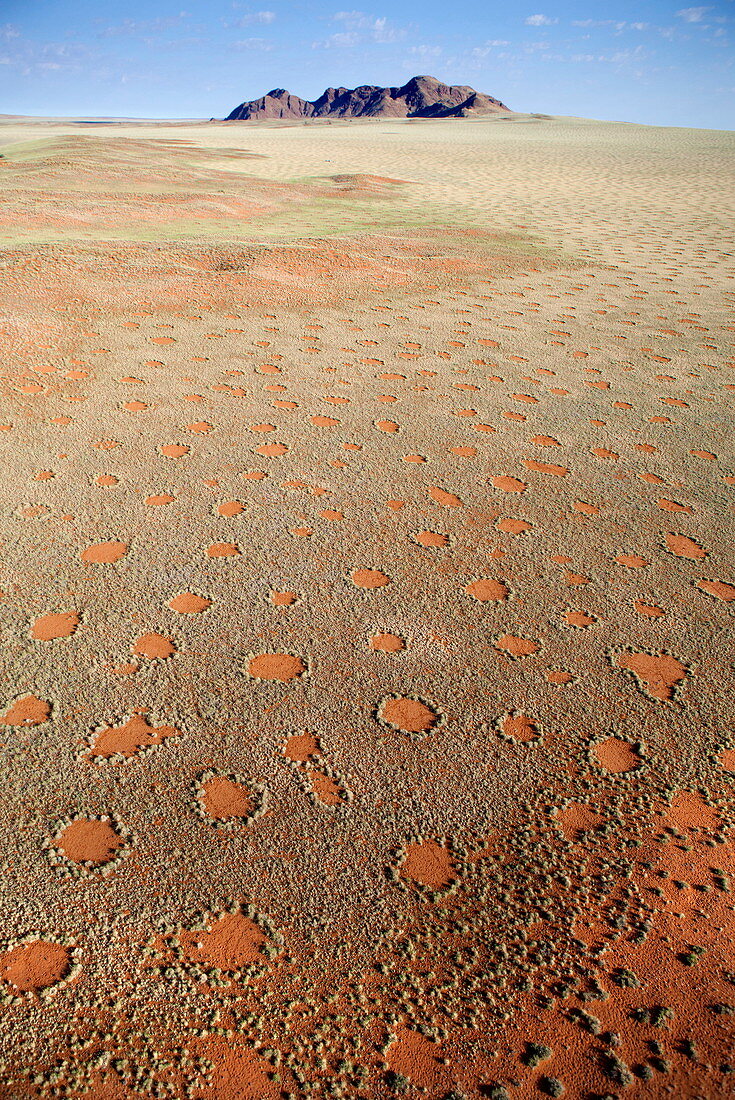 Aerial view from hot air balloon over magnificent desert landscape covered in Fairy Circles, Namib Rand game reserve Namib Naukluft Park, Namibia, Africa