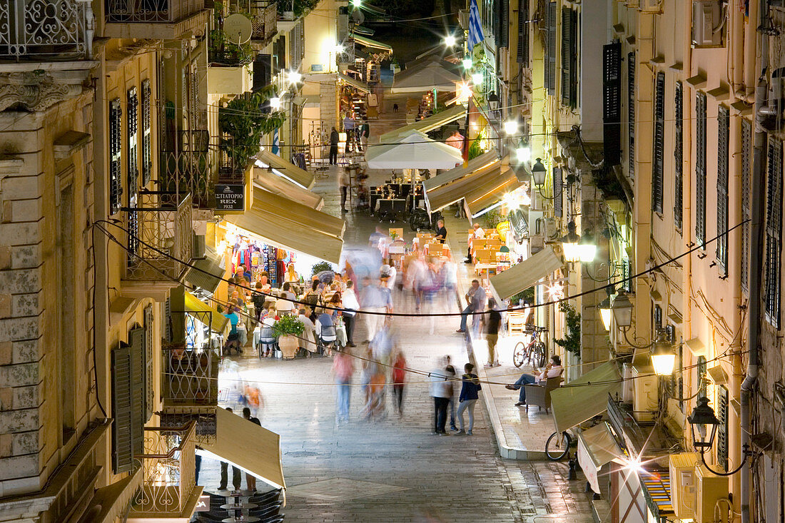 View by night over illuminated Odos Kapodistriou, Corfu Town, Corfu, Ionian Islands, Greek Islands, Greece, Europe