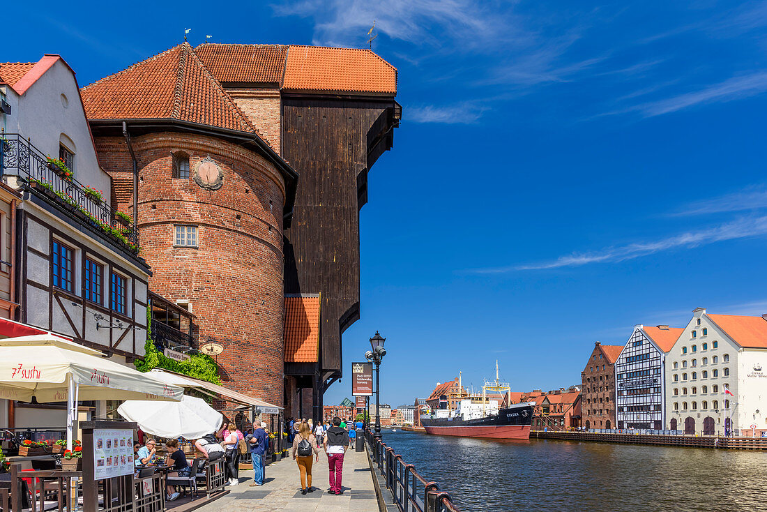 Gdansk, Main City, old town, old motlawa canal. Gothic crane, branch of the National Martime Museum. The ship-museum "Soldek", dockyard setting for reconstructed 17th-century granaries, housing modern national maritime museum. Gdansk, Main City, Pomorze region, Pomorskie voivodeship, Poland, Europe\n