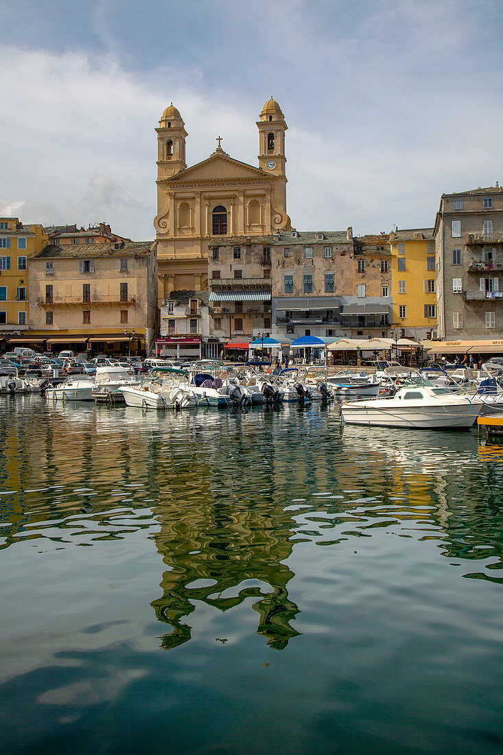 Boats moored in the port at Bastia with St. Jean Baptiste church, Bastia, Corsica, France, Mediterranean, Europe