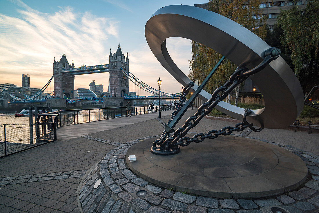 The Timepiece Sundial and Tower Bridge at sunset, St. Katharine's and Wapping, London, England, United Kingdom, Europe