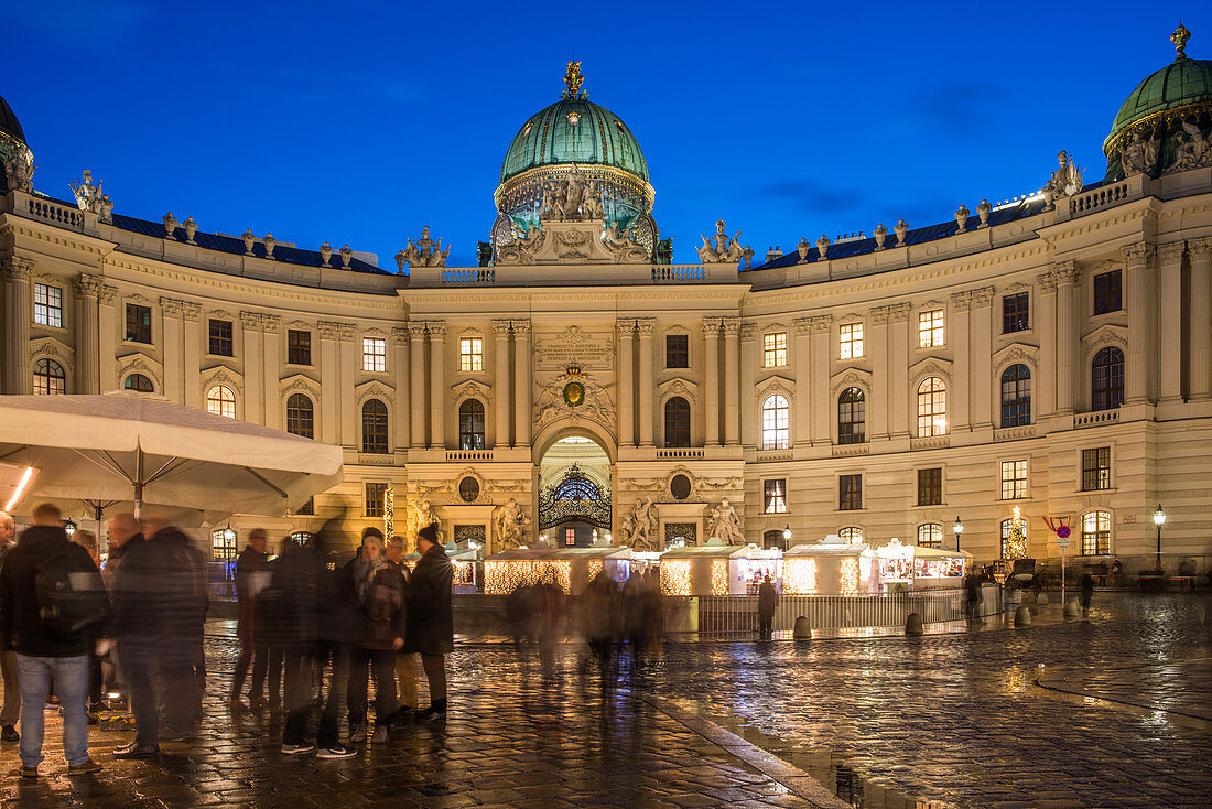 Christmas market on Michaelerplatz with Hofburg Palace at dusk, Vienna, Austria, Europe