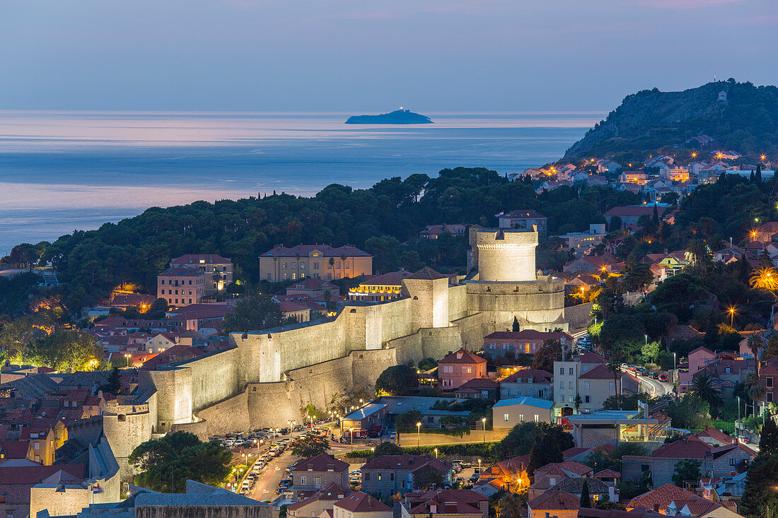 View over the illuminated city walls from above, dusk, the Adriatic Sea beyond, Dubrovnik, UNESCO World Heritage Site, Dubrovnik-Neretva, Dalmatia, Croatia, Europe