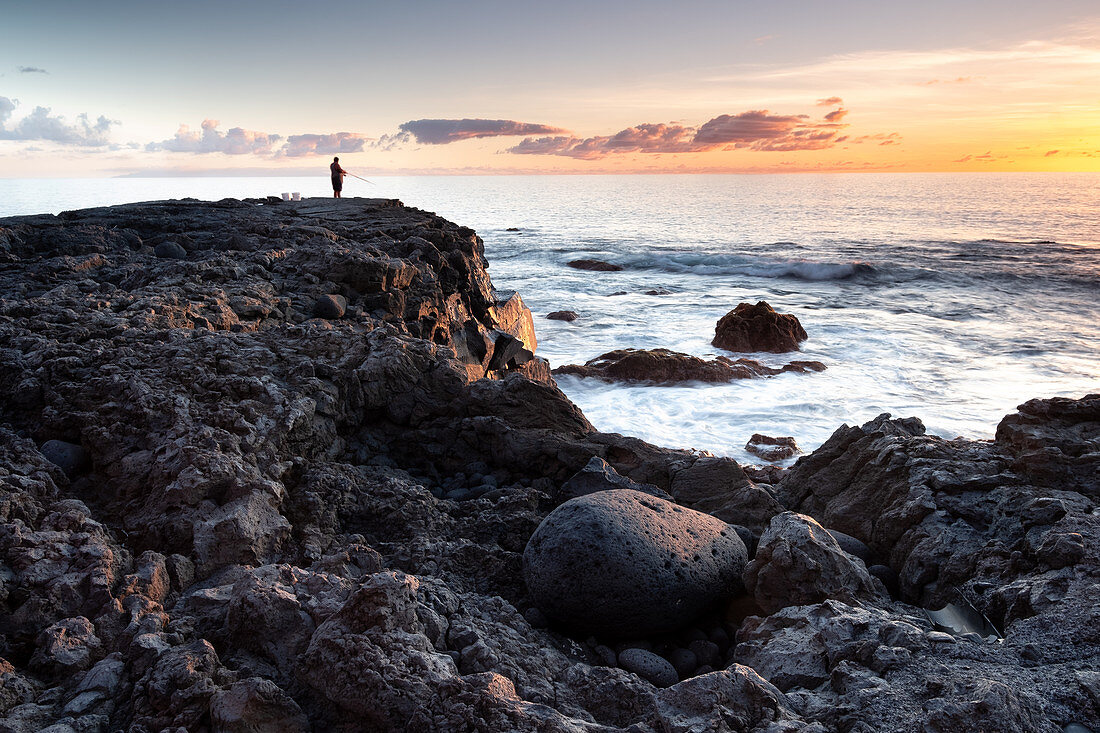 Fisherman on the coast of El Remo at sunset, La Palma, Canary Islands, Spain, Europe
