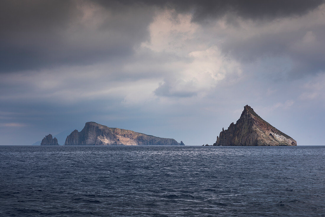 Basiluzzo island in front of Stromboli with clouds, Sicily Italy