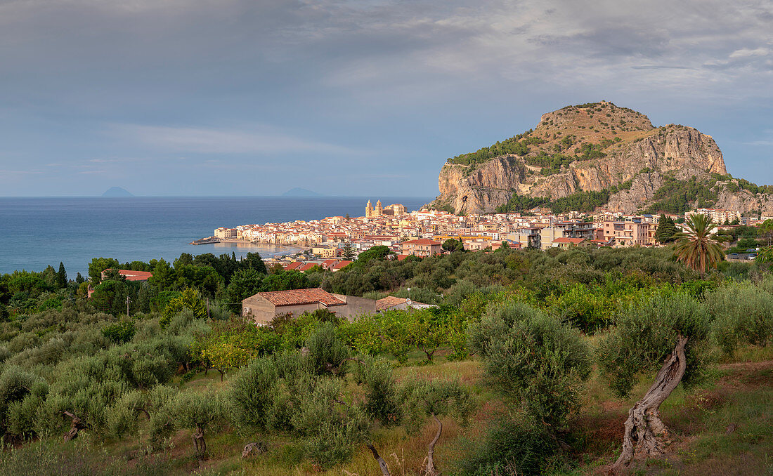 City of Cefalu with Rocca di Cefalù in the afternoon sun, Sicily Italy