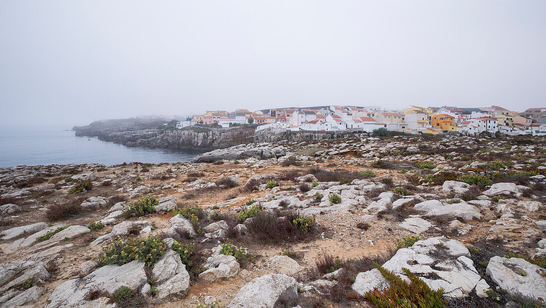 Houses on the cliffs of Peniche at dawn, Portugal