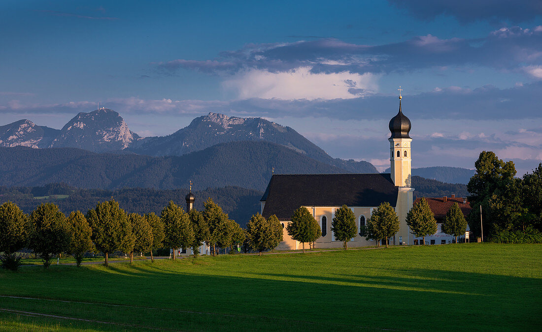 Pilgrimage church Wilparting am Irschenberg in summer, with mountains in the background, Bavaria